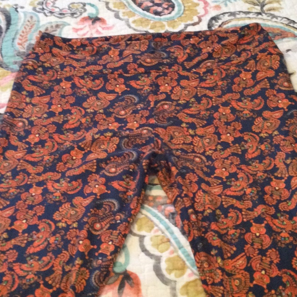 Brand new Lularoe Leggings, Size TC. Blue with Bird pattern in orange, green
